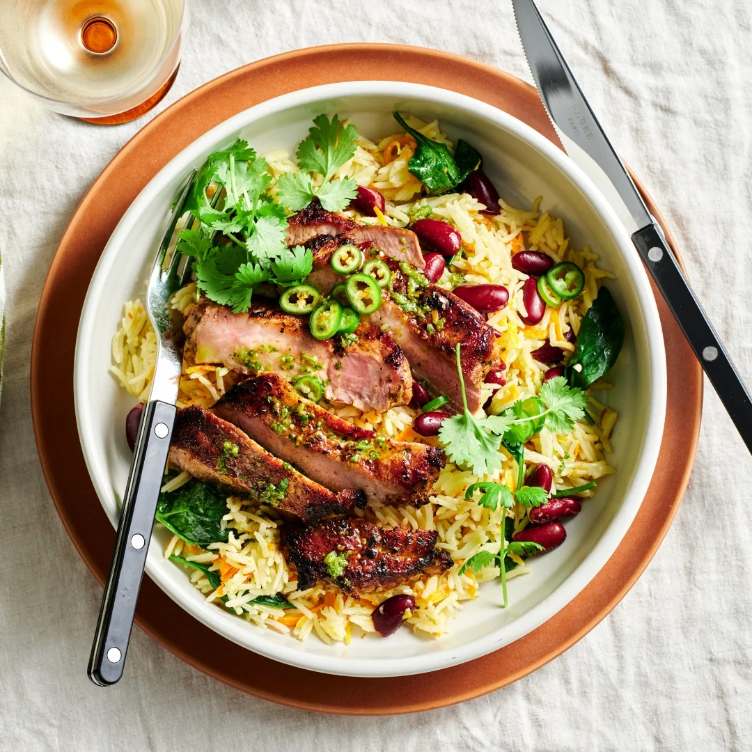 Gourmet Traveller Unveils a Vibrant Culinary Masterpiece: Maxwell Adey’s Mojo Pork Sirloin with Coconut and Carrot Rice